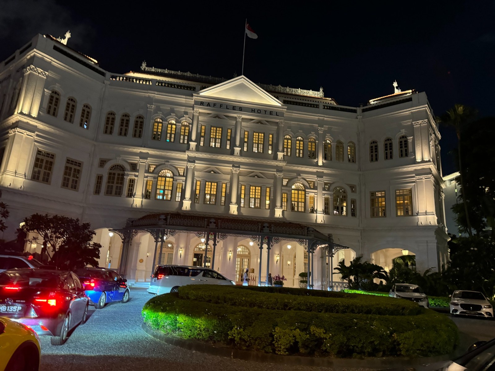 Raffles Hotel Singapore illuminated at night